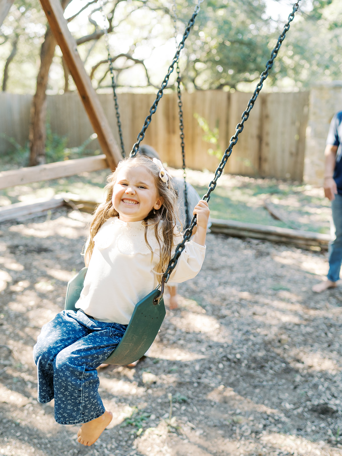 little girl swinging