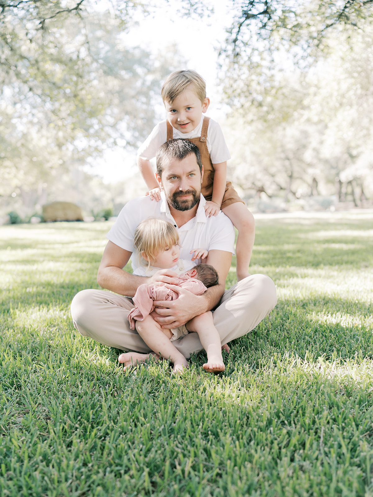 dad with three kids during in-home session