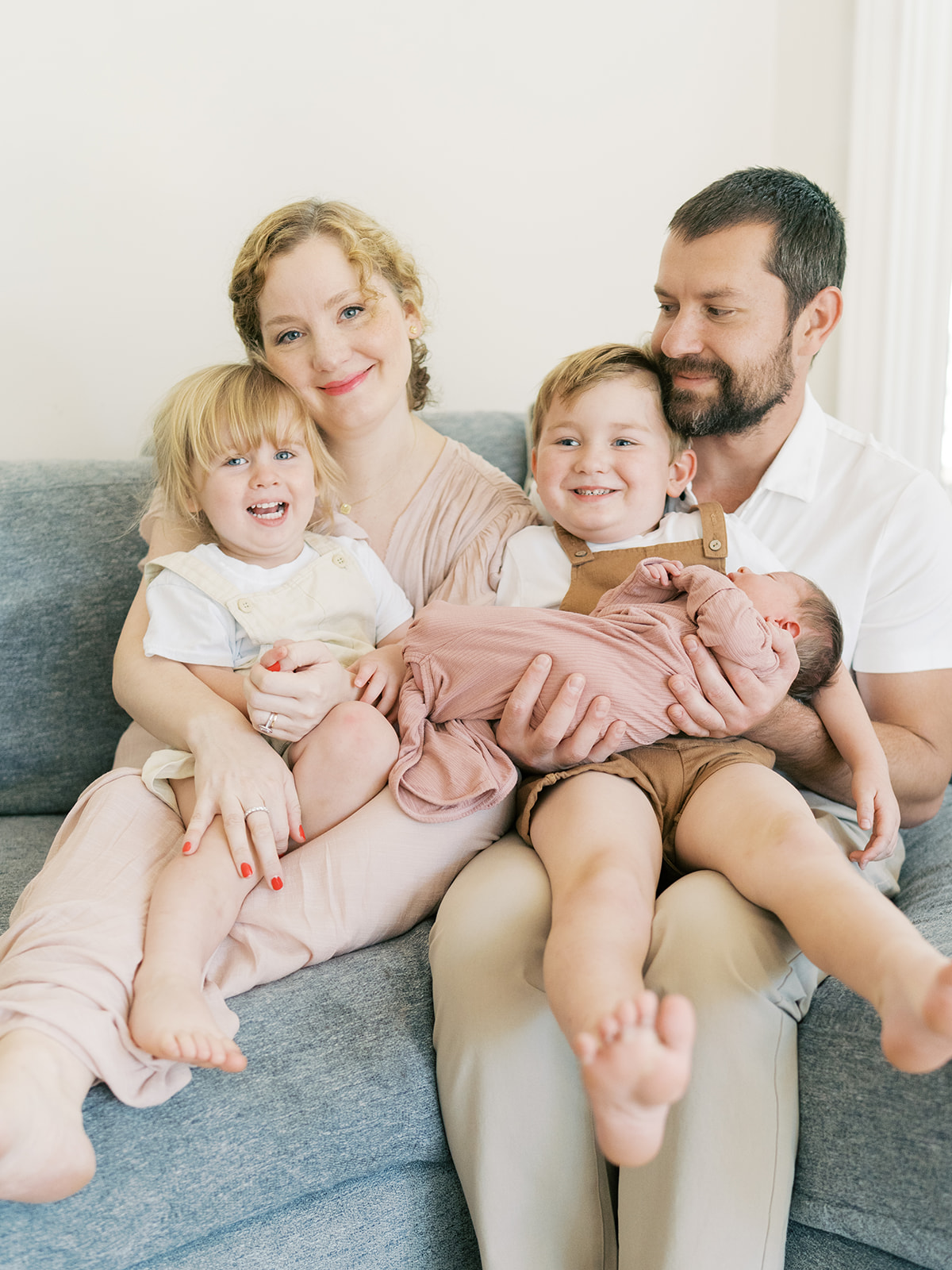 When Is the Best Time to Take Newborn Photos? | Family of five during lifestyle newborn session