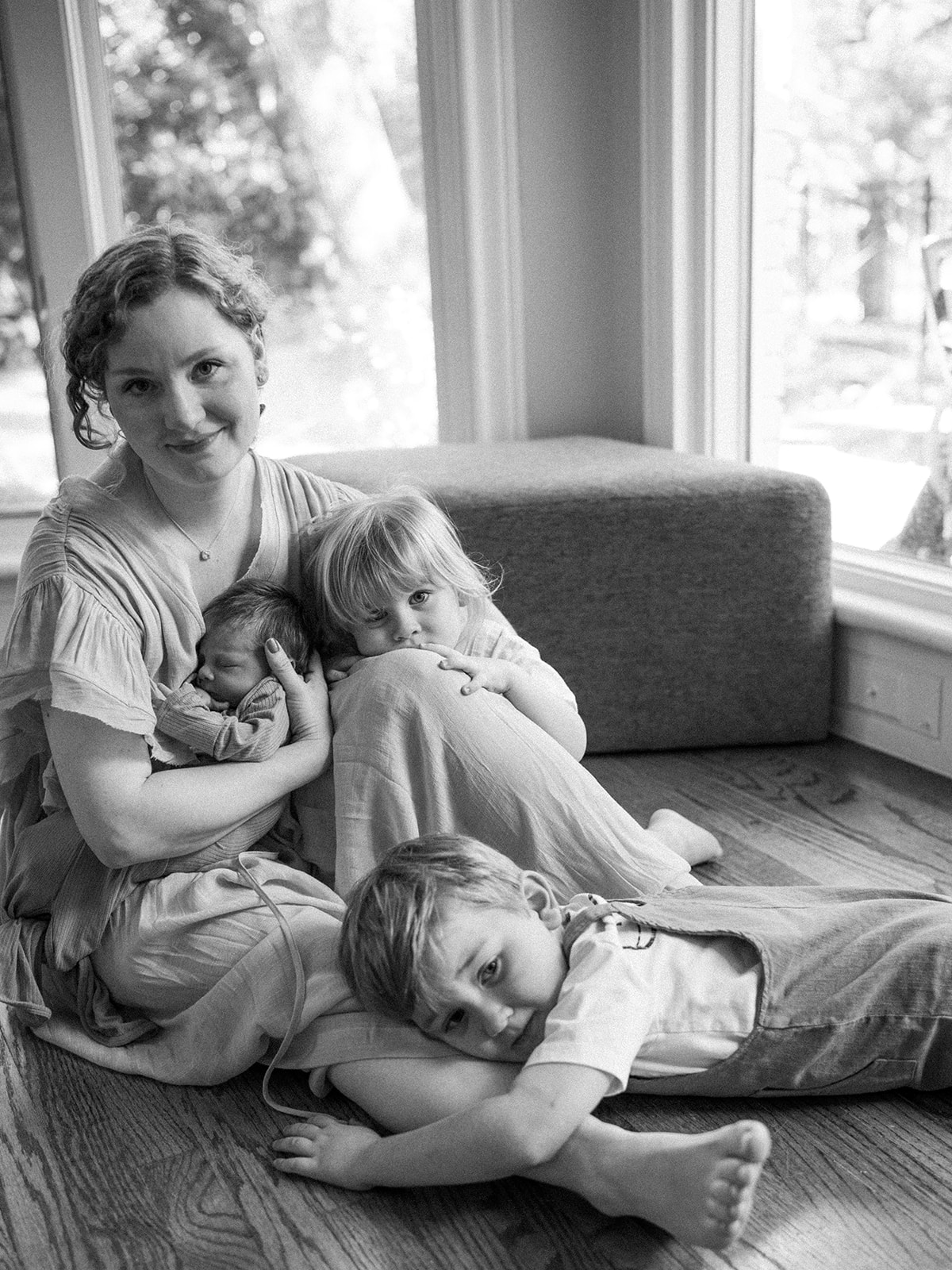 mom with three children during in-home newborn session