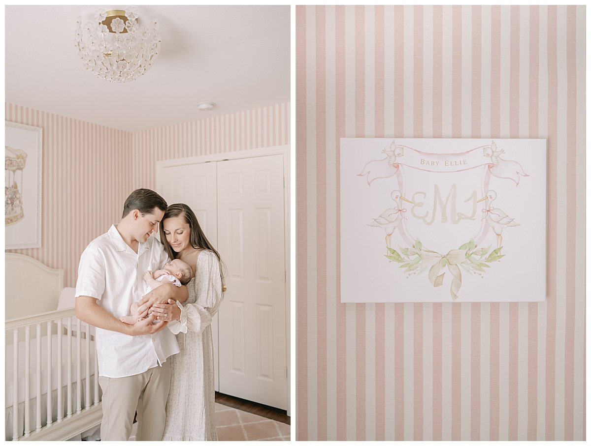 Mom and dad hold baby girl in pink nursery with striped wallpaper for their in-home newborn session in San Antonio, TX taken by Teressa Jane Photography, a San Antonio Newborn Photographer.